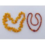 A butterscotch amber bead necklace, composed of graduated irregular polished beads, to a screw