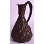 A 19TH CENTURY TIBETAN COPPER JUG with turquoise inset eyes, decorated with figures. 9.75ins high.