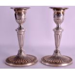 A PAIR OF ENGLISH SILVER CANDLESTICKS with flared fan shaped bases. London 1972. 7.25ins high.