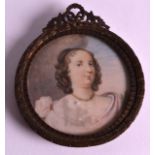A MID 19TH CENTURY EUROPEAN IVORY MINIATURE depicting a young girl within a landscape. 2.75ins x 2.