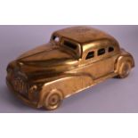 A NOVELTY ANTIQUE GENTLEMANS DESK INK STAND in the form of a Betel motor car. 10Ins wide.