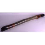 AN EARLY 20TH CENTURY AUSTRALIAN PAINTED DIDGERIDOO. 3Ft 6ins long.