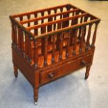 A LOVELY REGENCY CARVED WALNUT CANTERBURY of architectural form, with a single drawer upon slender