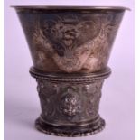 A 19TH CENTURY NORWEGIAN SILVER COMMUNAL CHALICE engraved with foliage and decorated in relief