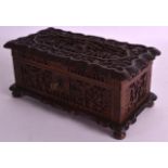 A MID 19TH CENTURY CHINESE CARVED SANDALWOOD CASKET with well decorated scenes formed with