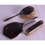 A STERLING SILVER AND TORTOISESHELL VANITY SET. Birmingham 1931. (3)