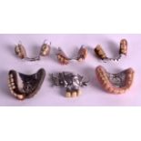 AN ASSORTMENT OF EARLY 20TH CENTURY DENTIST DENTURES all with white metal mounts. (6)