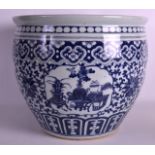 A MID 19TH CENTURY CHINESE BLUE AND WHITE JARDINIERE painted with panels of precious objects,