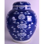 A CHINESE QING DYNASTY BLUE AND WHITE GINGER JAR AND COVER Kangxi style, painted with flowering