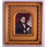 A MID 19TH CENTURY EUROPEAN IVORY MINIATURE depicting a male within an interior. 2.5ins x 3.75ins.