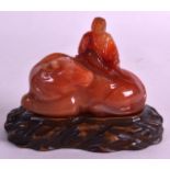 A 19TH CENTURY CHINESE CARVED AGATE FIGURE OF A BUFFALO modelled with a seated male upon it. 3.