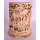 A 19TH CENTURY CHINESE CANTON IVORY BRUSH POT extensively carved with figures, landscapes and