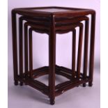 A NEST OF FOUR MINIATURE CHINESE TABLES of square form. Largest 1ft 1ins x 9ins.