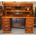 A LARGE EARLY 20TH CENTURY AMERICAN ROLLTOP DESK made by the Feige Desk Company, with numerous