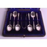 A CASED SET OF SILVER APOSTLE SPOONS together with matching tongs. Birmingham 1908.