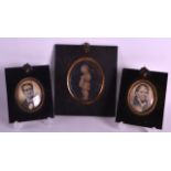 A GROUP OF THREE MID 19TH CENTURY PORTRAIT MINIATURES within ebonised frames. (3)