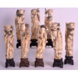 A FINE SET OF EIGHT EARLY 20TH CENTURY CHINESE POLYCHROMED IVORY IMMORTALS Qing, each modelled in