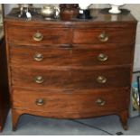 A LARGE VICTORIAN MAHOGANY CHEST OF DRAWERS comprising of three long drawers with brass handles.