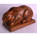 A 1940S SCOTTISH CARVED WOOD MODEL OF A HARE  presented to John Crawford, by the Stewartry of