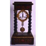 A LATE 19TH CENTURY FRENCH PORTICO CLOCK with reeded columns, the dial contained within an ormolu