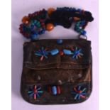 AN UNUSUAL SOUTH AMERICAN BEAD AND LEATHER PURSE formed with large turquoise, green, orange and