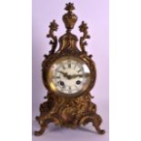 A 19TH CENTURY FRENCH GILT METAL MANTEL CLOCK the dial painted with black numerals, within a