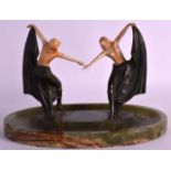 A GOOD ART DECO COLD PAINTED BRONZE AND IVORY FIGURAL GROUP depicting two nude females holding aloft