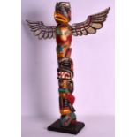 A VINTAGE NORTH AMERICAN PAINTED TOTEM POLE with bird and figural decoration. 1Ft 11ins high.