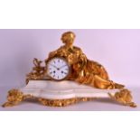 A MID 19TH CENTURY FRENCH ORMOLU MANTEL CLOCK modelled as a classical reclining female, her arm