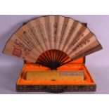 A 1960S CASED SCROLL representing traditional culture, together with a matching fan. (2)