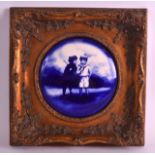 A FRAMED VICTORIAN BLUE AND WHITE PANEL depicting two young boys within a landscape. Panel 6ins