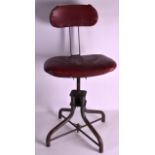 A VINTAGE CAST IRON AND RED LEATHER INDUSTRIAL CHAIR upon four splayed legs.