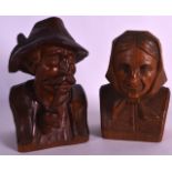 A PAIR OF EARLY 20TH CENTURY BAVARIAN CARVED WOOD BUSTS. 6.5ins high.