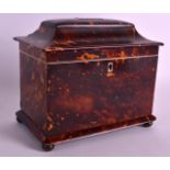 A REGENCY CARVED TORTOISESHELL TEA CADDY of rectangular form, inset with a plaque, with ivory