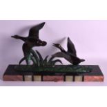 A FRENCH ART DECO COLD PAINTED SPELTER FIGURAL GROUP depicting ducks in flight, upon a marble