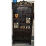 A FINE 19TH CENTURY CHINESE CARVED HARDWOOD DISPLAY CABINET unusually supported on a rectangular