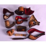 A COLLECTION OF MEERCHUM PIPES in various forms, contained with leather cases. (qty)