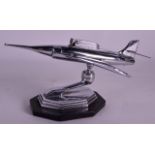 A VINTAGE PRESENTATION CHROME TABLE LIGHTER in the form of a plane. 9Ins wide.