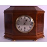 AN EDWARDIAN WALNUT MANTEL STRIKING MANTEL CLOCK by Vickery of London. 12Ins wide.