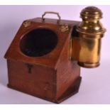 A VICTORIAN/EDWARDIAN OAK CASED SHIPS COMPASS with rising top and brass side attachment. 11.5ins