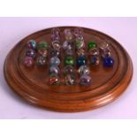 A RARE SET OF ANTIQUE DOUBLE CASED MICA MARBLES with solitaire board. (qty)