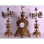 A LARGE 19TH CENTURY FRENCH GILT METAL MANTEL CLOCK of scrolling rococo form, the dial painted