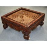 A GOOD 19TH CENTURY ANGLO INDIAN CARVED WOOD STOOL with profusely carved scrolling vines. 1Ft 5ins
