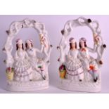 A PAIR OF 19TH CENTURY STAFFORDSHIRE FIGURAL GROUPS depicting a young couple seated beside