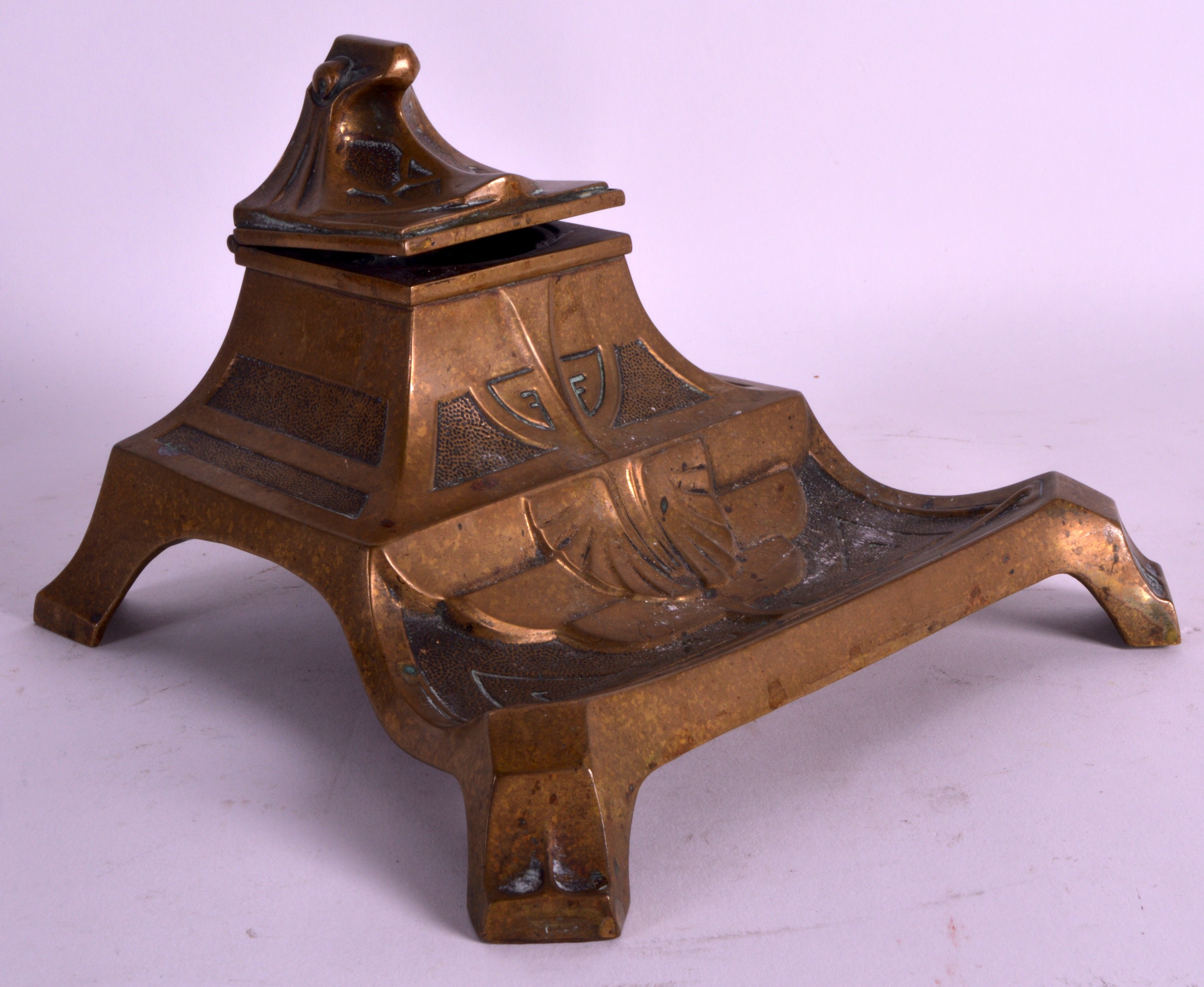 AN ART NOUVEAU BRONZE DESK STANDING INKWELL all over decorated with motifs. 7Ins wide.