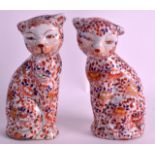 A PAIR OF MID 20TH CENTURY IMARI PORCELAIN CATS decorated with foliage. 7.5ins high.