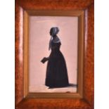 AN EARLY 19TH CENTURY SILHOUETTE contained within a walnut frame. Image 11ins x 6.5ins.