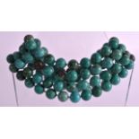 A GOOD EARLY 20TH CENTURY CARVED TURQUOISE NECKLACE of uniform size and varying colour tones. 4Ft