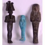 AN EARLY EGYPTIAN BRONZE FIGURE OF GOD together with two shabti figures. Largest 6.75ins high. (3)