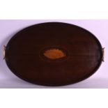 AN EDWARDIAN MAHOGANY TEA TRAY inset with a panel of shell. 1Ft 8ins wide.